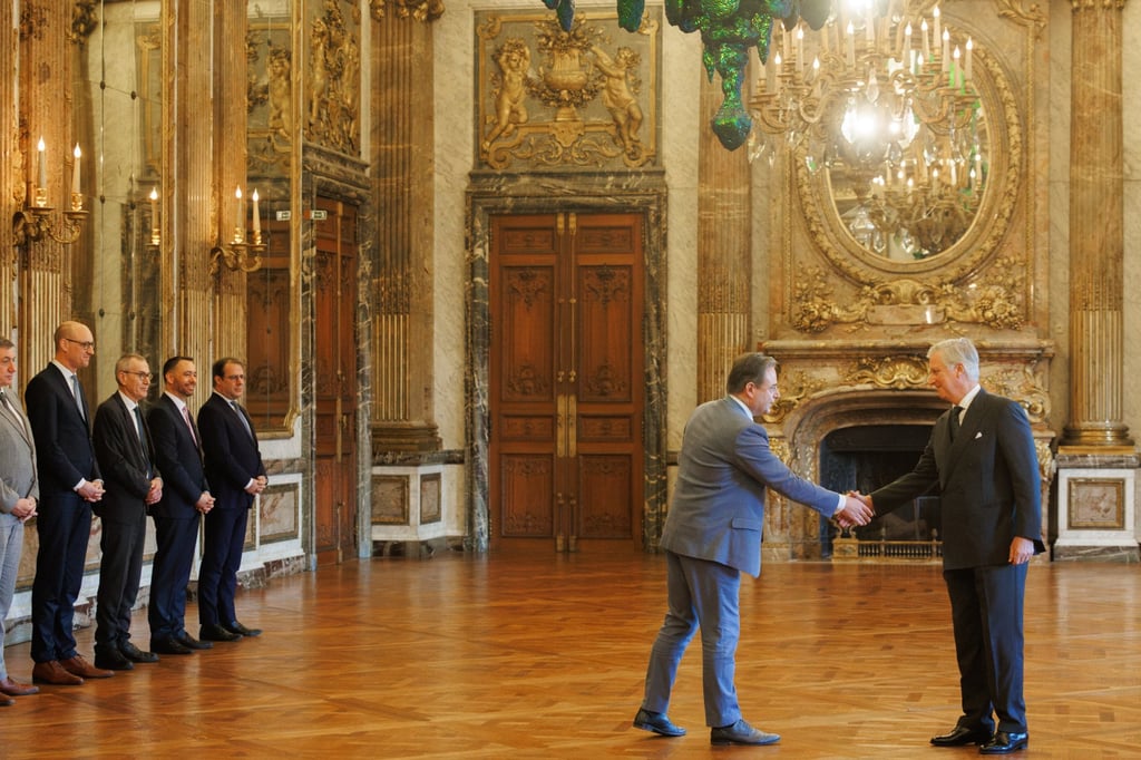 Belgium’s King Philippe (right) shakes hands with new Prime Minister Bart De Wever at the swearing-in ceremony at the Royal Palace in Brussels. Photo: EPA-EFE