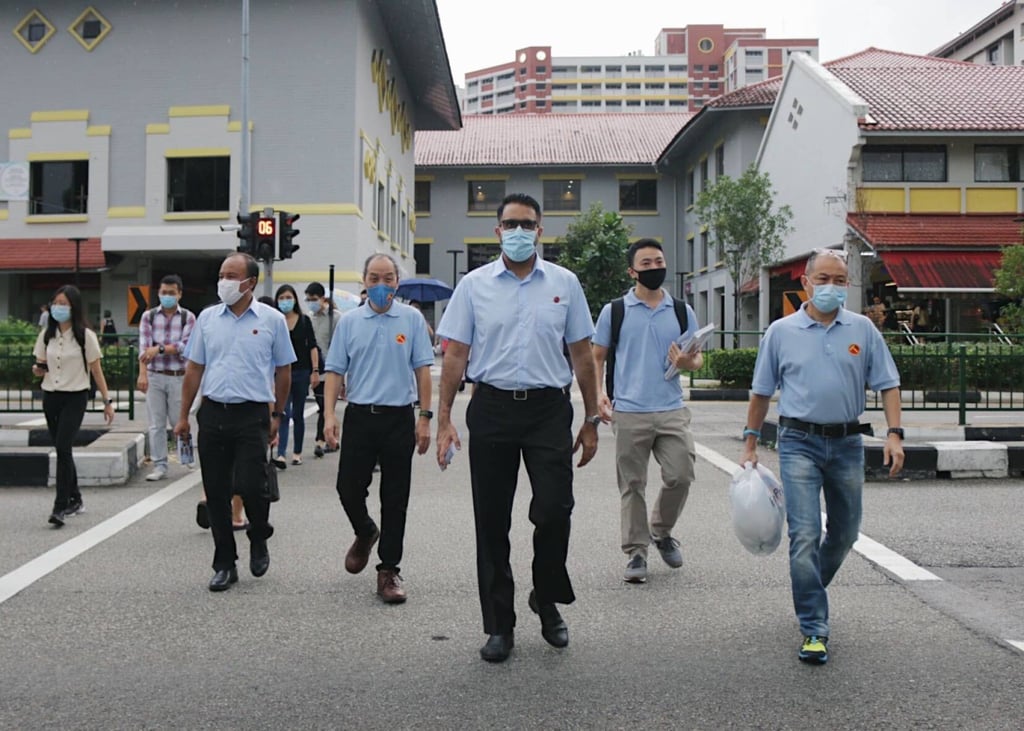 Pritam Singh (centre) with former Workers’ Party chief Low Thia Khiang (fourth from right) and party members at their Aljunied stronghold in the lead-up to the July 10, 2020 election. Photo: Dewey Sim