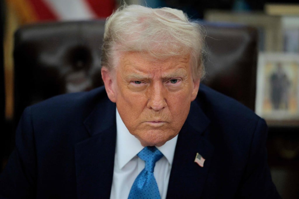 US President Donald Trump talks to reporters about tariffs against China, Canada and Mexico on Friday. Photo: Getty Images via AFP