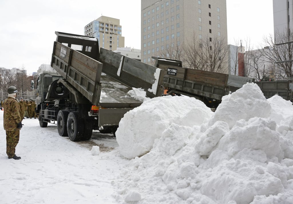 Snow is trucked into Odori Park in January 2020 for the Sapporo Snow Festival. Photo: Kyodo