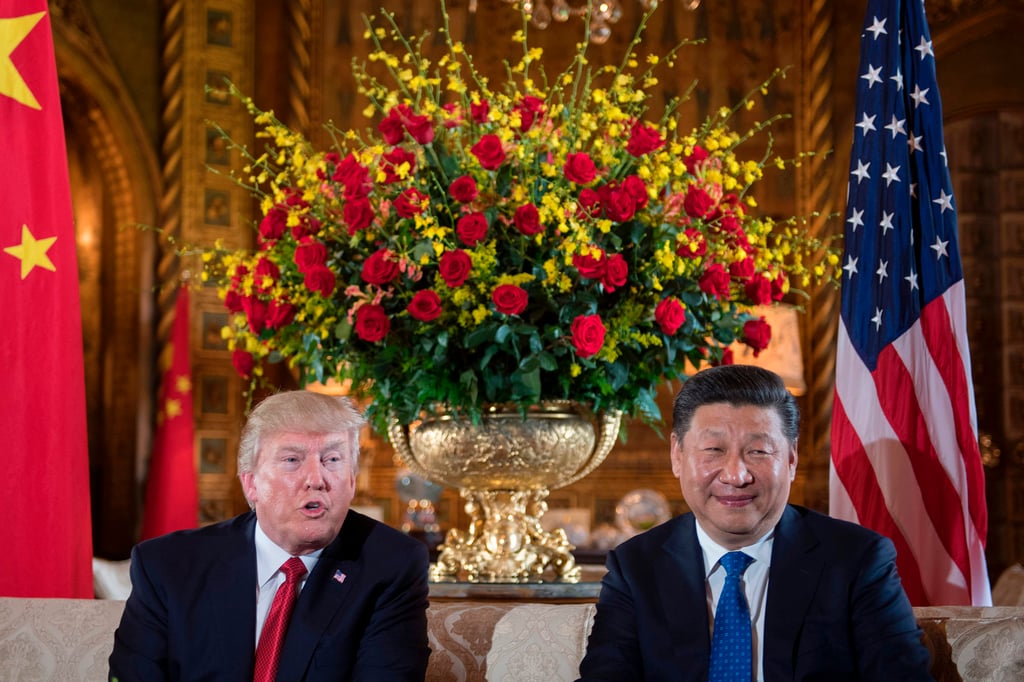 US President Donald Trump, left, sits with Chinese President Xi Jinping during a bilateral meeting in Florida in 2017. Photo: AFP/Getty Images/TNS