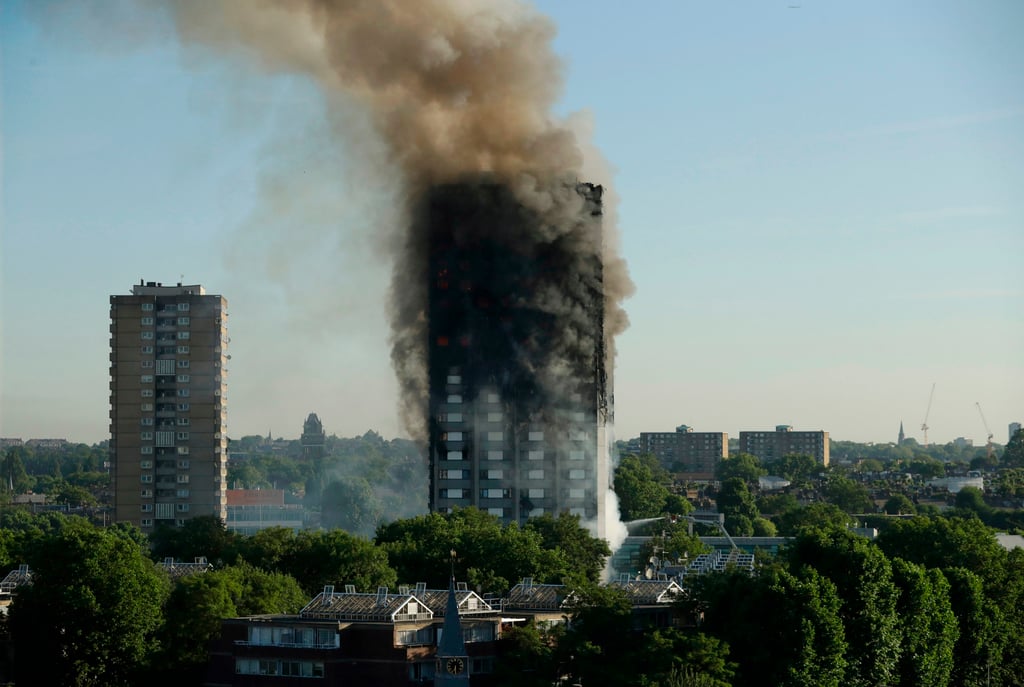 Smoke rises from Grenfell Tower in London in June 2017, in a blaze that killed 72 people. Photo: AP