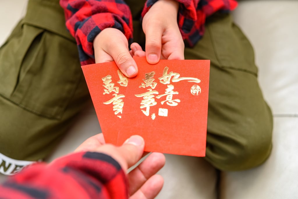 In many families red packets given to children are kept by the parents. Photo: Shutterstock