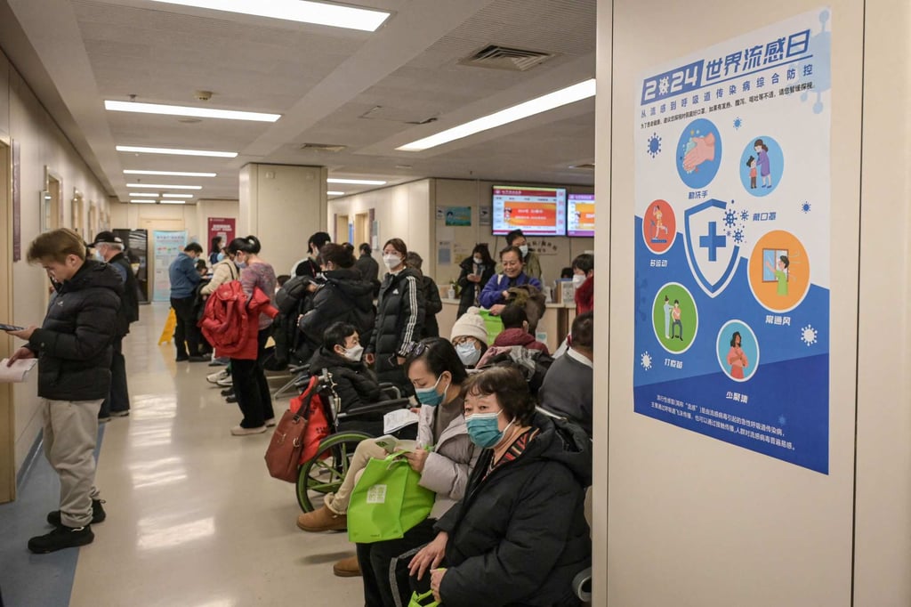 People wearing masks wait in the outpatient area of a hospital in Beijing on January 8. Photo: AFP