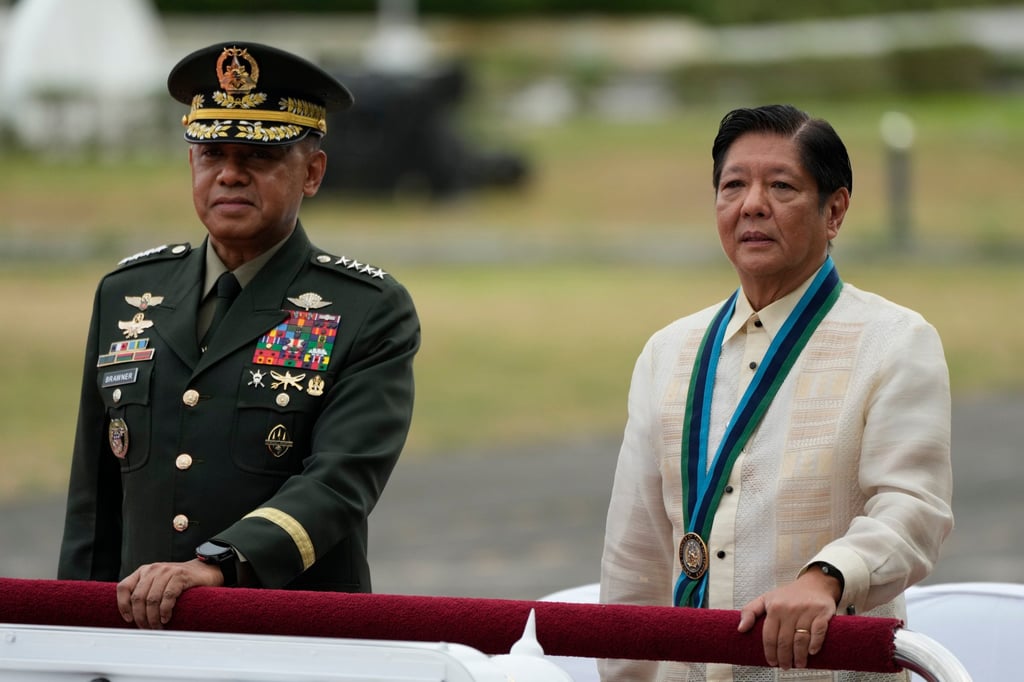 Philippine President Ferdinand Marcos Jnr (right) rides beside Philippine Military Chief Romeo Brawner Jnr at the Philippines at military headquarters Camp Aguinaldo in Quezon City, on December 20, 2024. Photo: AP