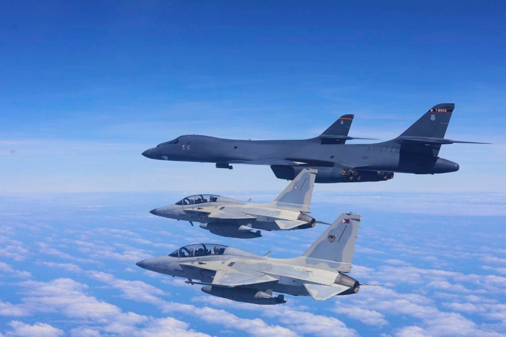 Two Philippine Air Force FA-50 fighter jets fly with two US Air Force B-1 bomber aircraft during a joint patrol and training over the South China Sea on February 4. Photo: Philippine Air Force via AP