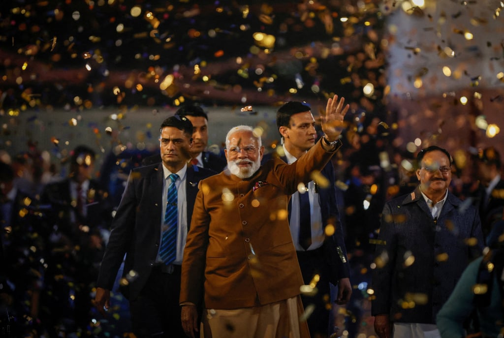 Indian Prime Minister Narendra Modi gestures at the Bharatiya Janata Party headquarters in New Delhi on Saturday after BJP’s win in the Delhi state elections. Photo: Reuters