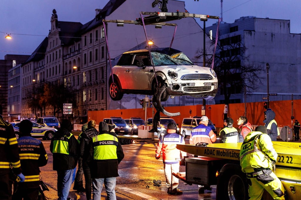 A car is lifted onto a tow truck at the scene in Munich. Photo: dpa