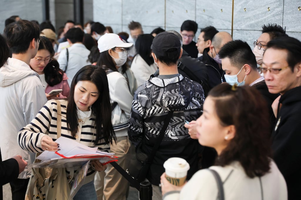 Potential buyers crowd the entrance to the Quarry Bay sales office for New World Development’s State Pavilia project. Photo: Edmond So