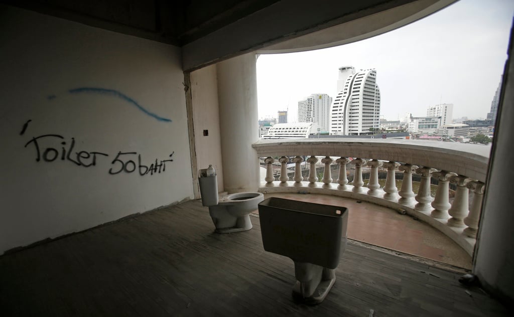 Unattached toilets sit in an open room in the empty Sathorn Unique building in Bangkok, Thailand, in 2017. Photo: AP