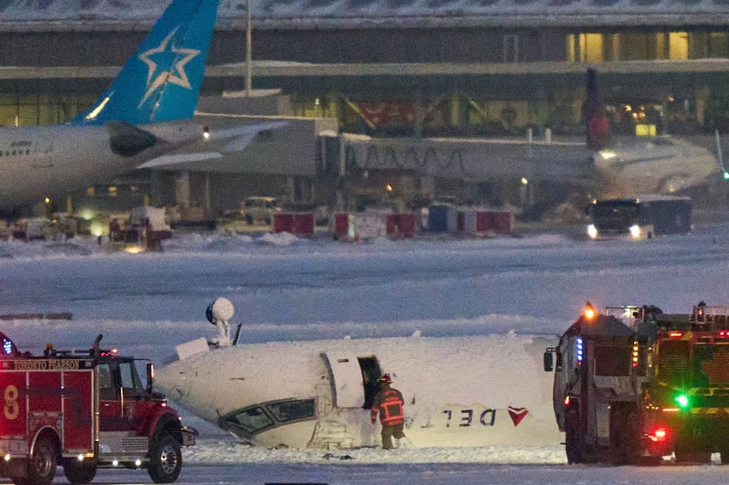 The plane flipped onto its roof on the runway. Photo: AFP
