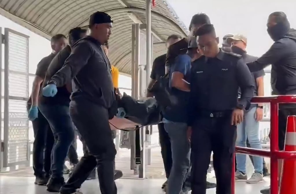 Police carry “Ah Boy” in a body bag in this still from a social media video after he was killed in a shoot-out early on Tuesday morning. Photo: X/beritartm