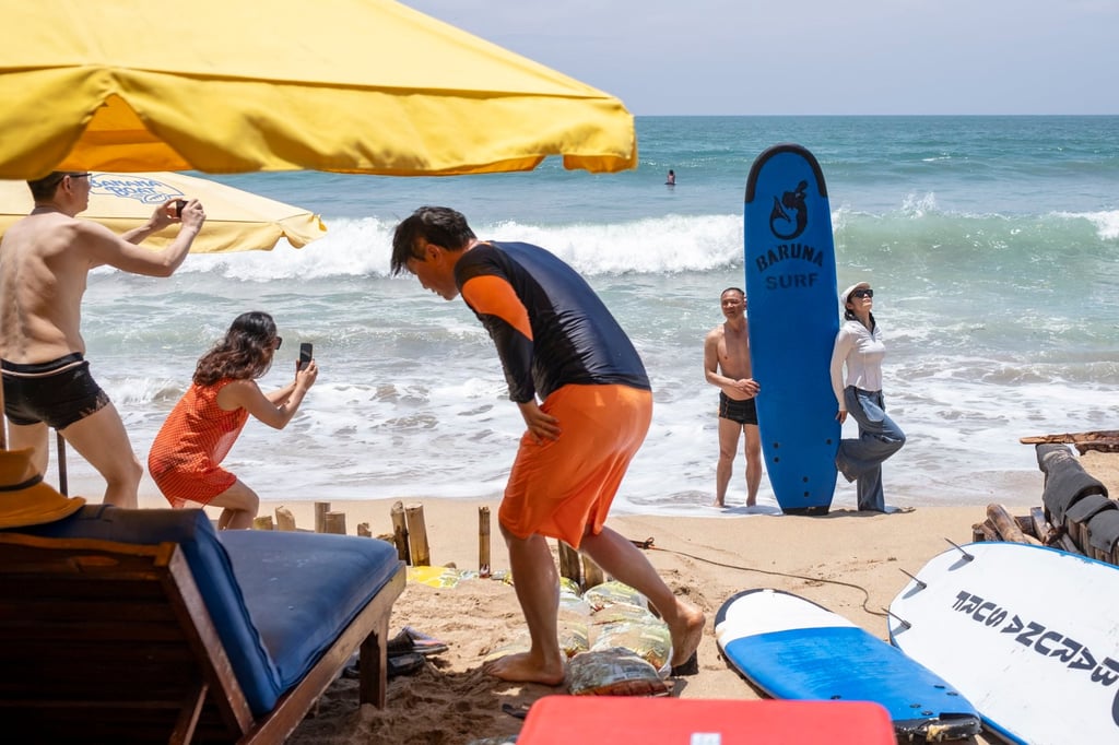 Tourists at Kuta Beach in Bali, Indonesia. More than 6.3 million international travellers visited Bali last year. Photo: EPA-EFE