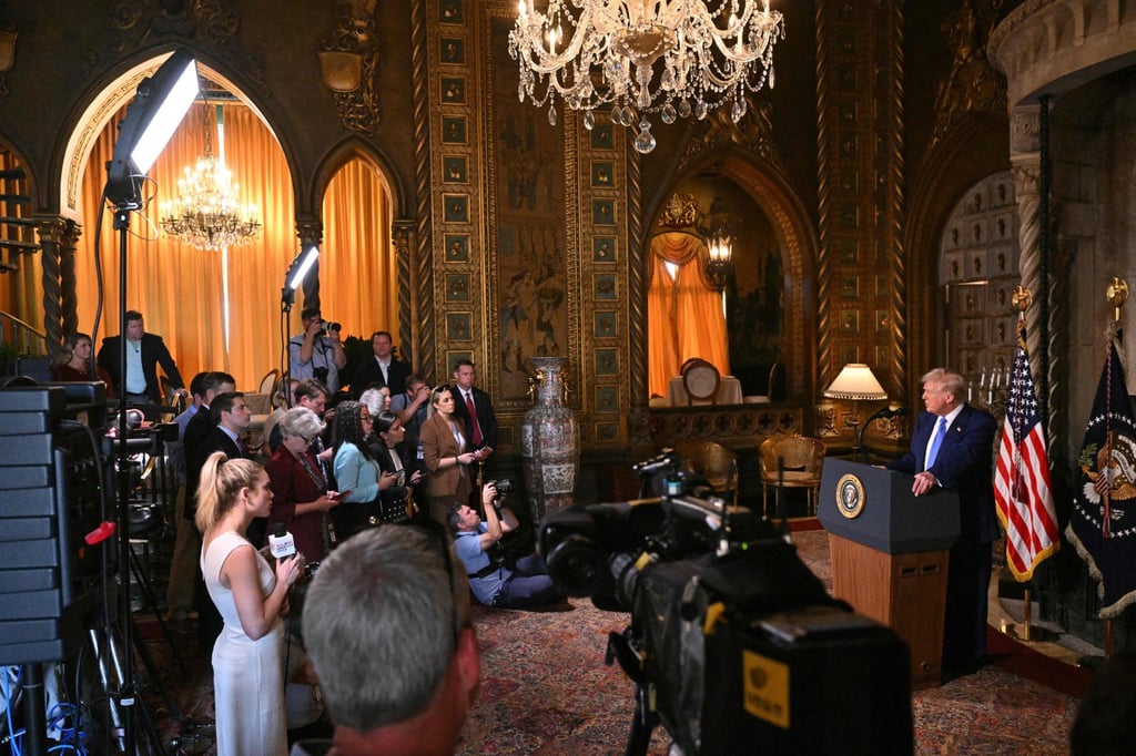 US President Donald Trump takes a question at his Mar-a-Lago resort on Tuesday. Photo: AFP