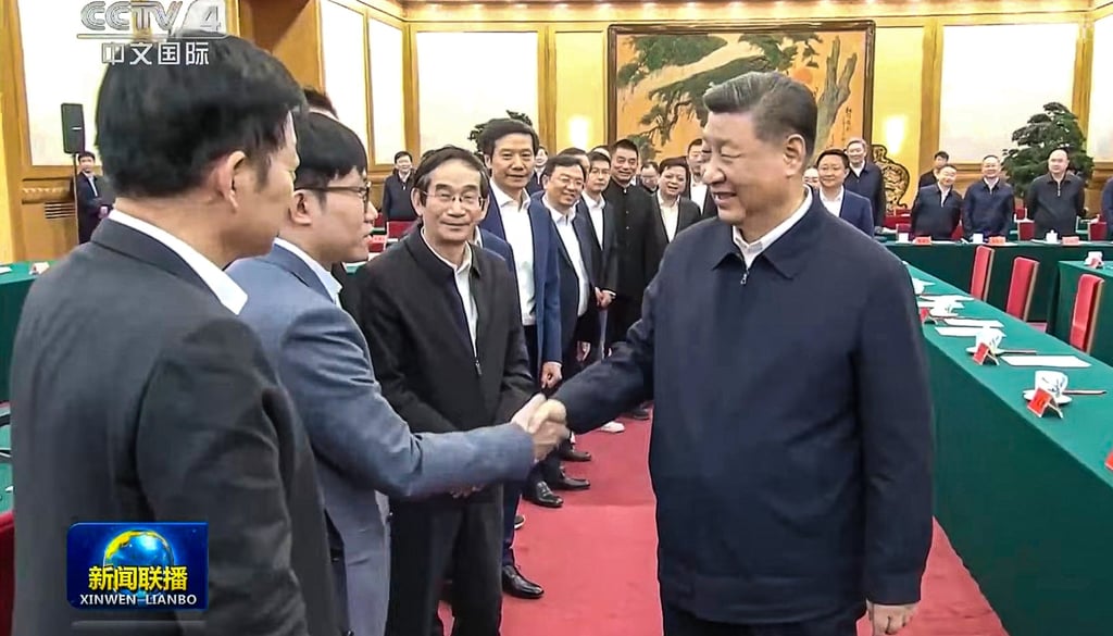DeepSeek founder and chief executive Liang Wenfeng, second from left, exchanges greetings with President Xi Jinping at a symposium held in Beijing on Monday. Photo: CCTV
