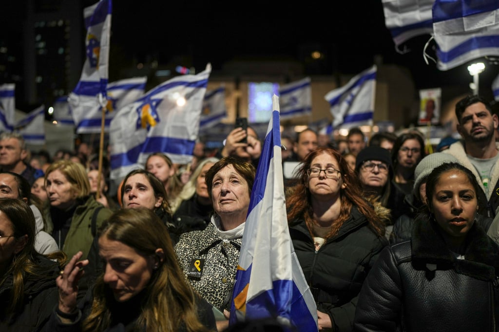 People in Tel Aviv, Israel hold a vigil after the bodies were handed over. Photo: AP