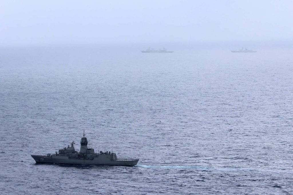 The Royal Australian Navy ship HMAS Arunta (lower left) sailing near the PLA Navy frigate Hengyang in the Tasman Sea on February 13. Photo: Australian Defence Force via AFP