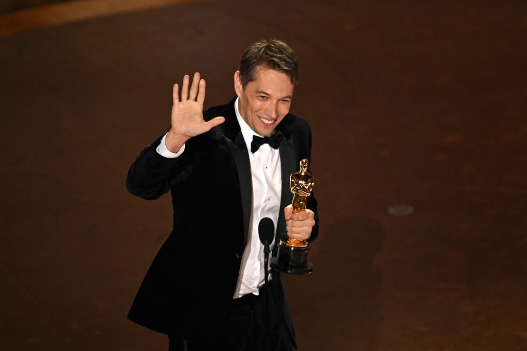 Sean Baker accepts the award for best director for Anora at the 97th Academy Awards. Photo: AFP