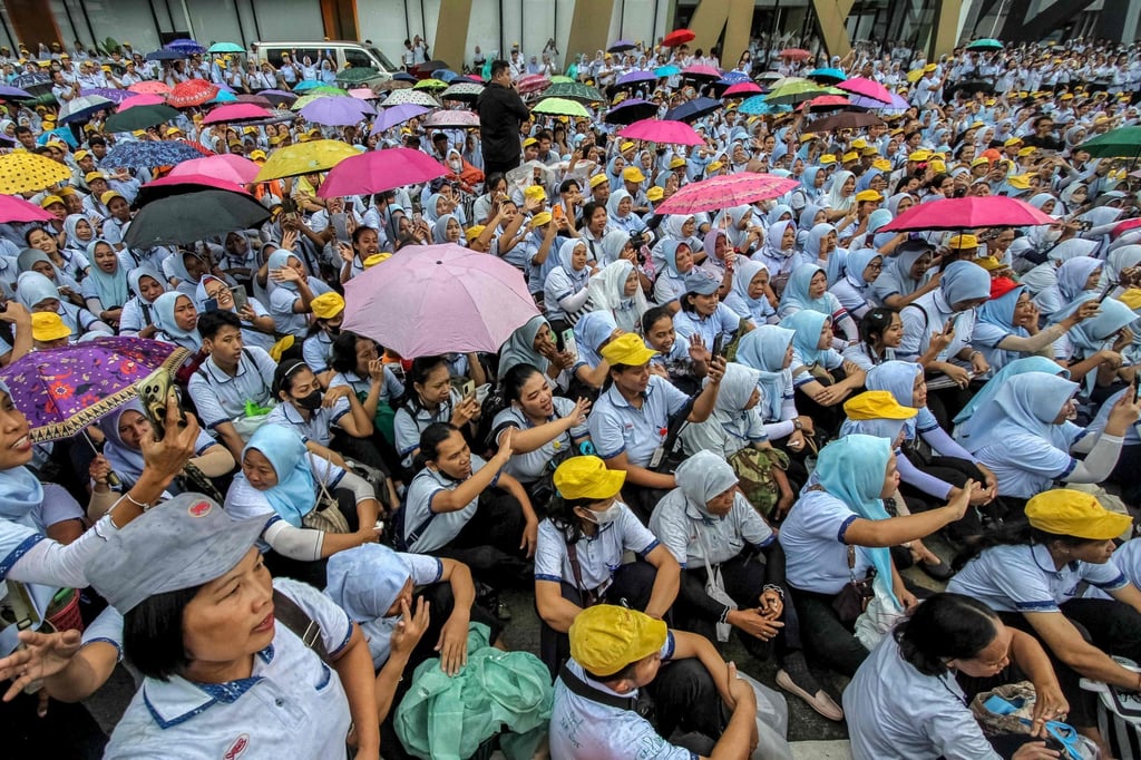 Former Sritex workers gather as they listen to a farewell speech in Sukoharjo, Central Java, on Friday. Photo: AFP
