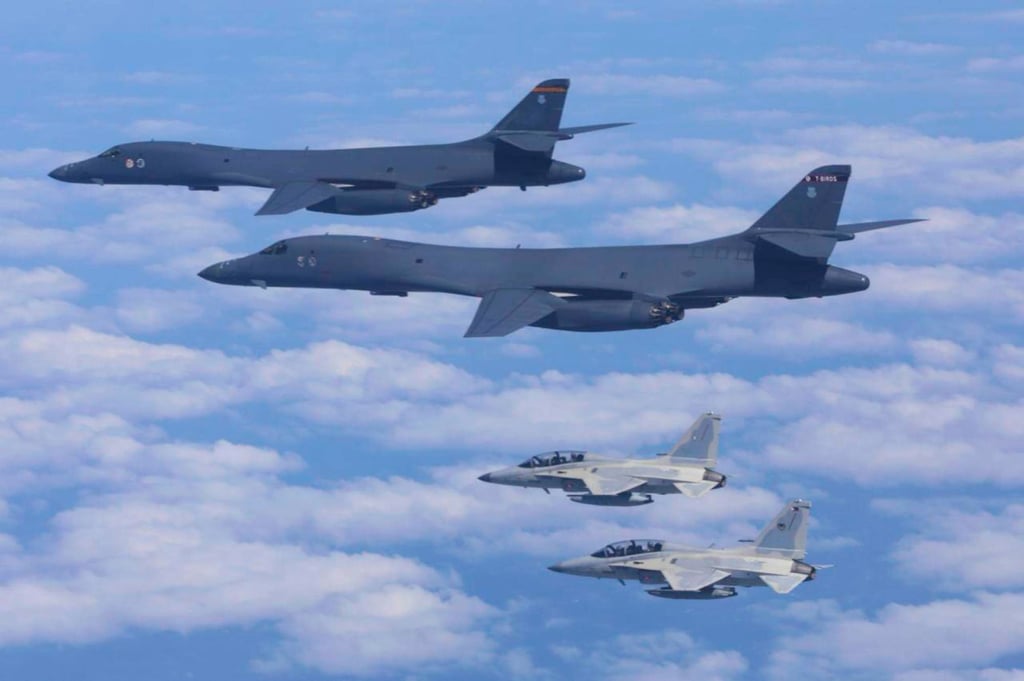 Two Philippine Air Force FA-50 fighter jets fly with two US Air Force B-1 bomber aircraft during a joint patrol and training over the South China Sea on February 4, 2025. Photo: AP