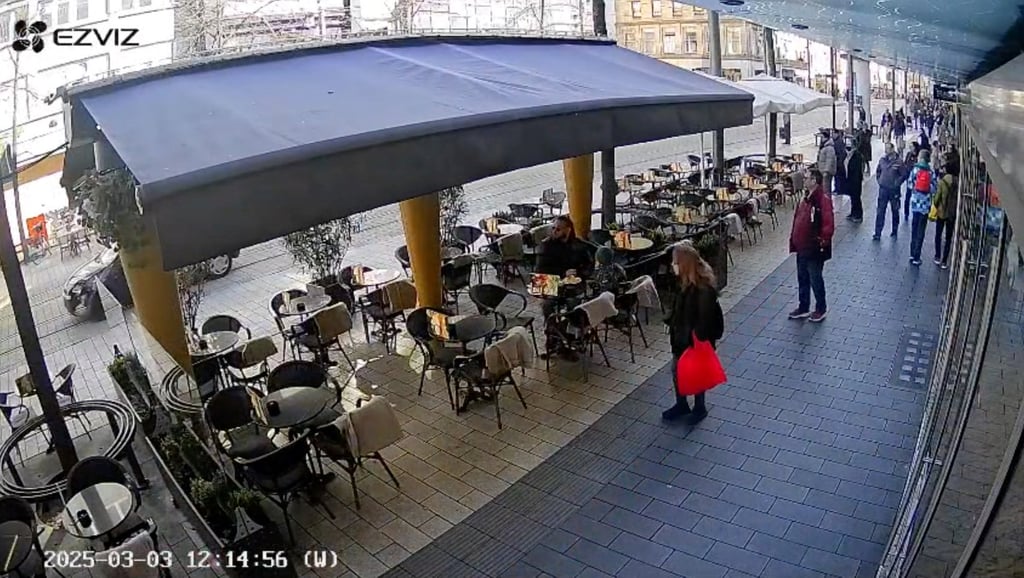 A still frame from CCTV footage shows the car speeding past a coffee tent. Photo: Eiscafe Del Sole Mannheim via Reuters