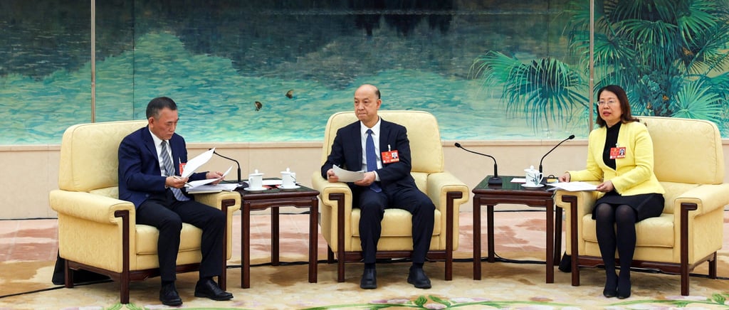 Zou Zhenqiu (left) takes part in an integration-themed NPC panel discussion in Beijing on Sunday. Photo: Reuters