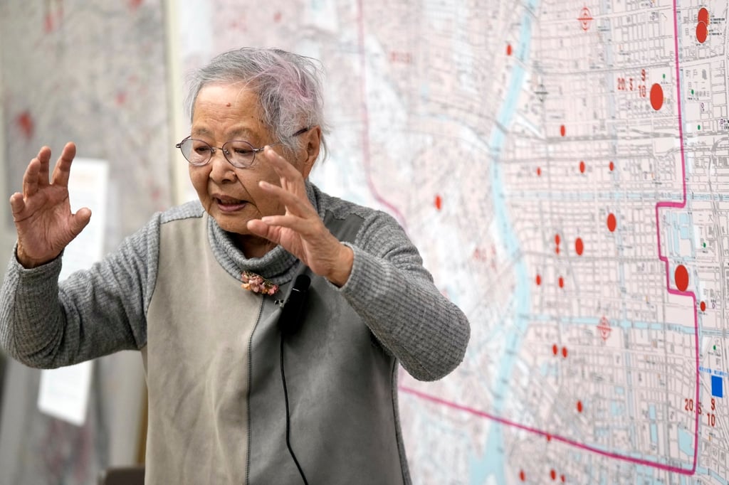 Shizuyo Takeuchi, 94, shares her experience of the Tokyo firebombing last month in front of a map of the parts of Japan’s capital that were damaged. Photo: AP