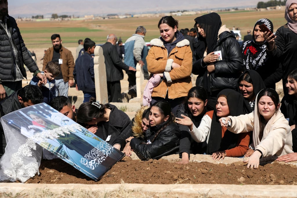 Mourners gather for the funeral of a woman who was killed in Latakia. Photo: Reuters