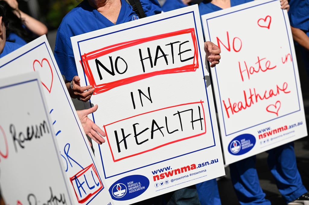 Australian nurses and medical professionals gather during a rally against hate speech in Sydney last month. Photo: AAP Image via AP