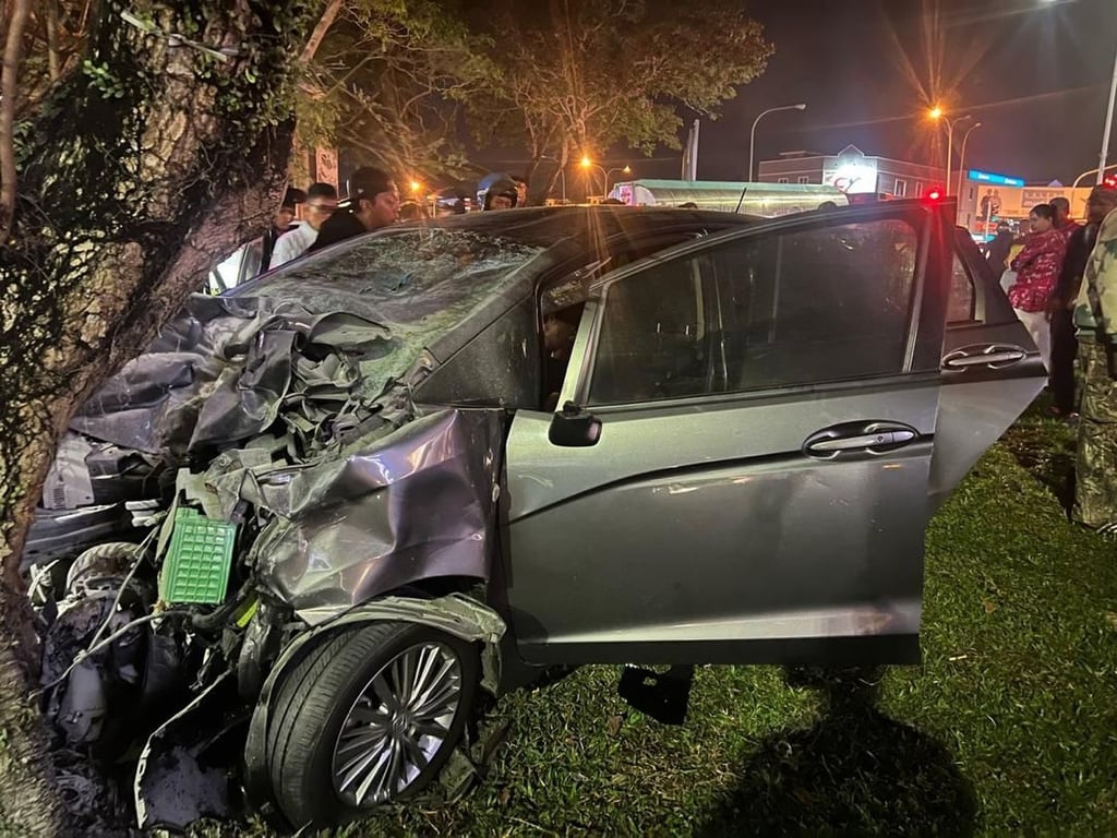 Two students were killed on the spot after their motorcycle collided with a car in Senawang district in Malaysia’s southern Negeri Sembilan state. A third victim later died in hospital. Photo: Handout