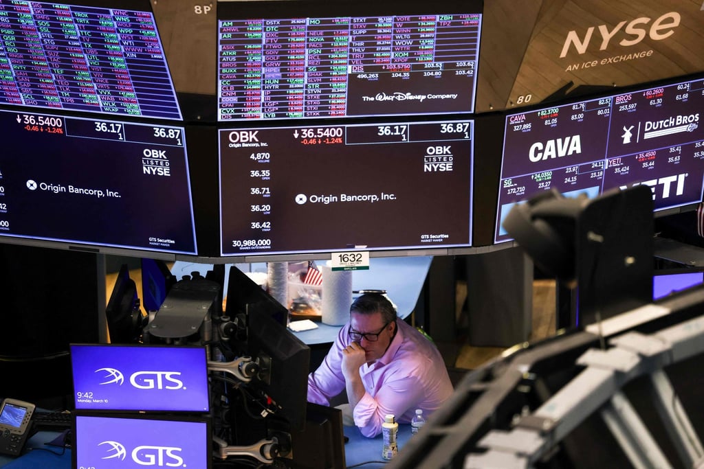 A trader on the floor of the New York Stock Exchange. Photo: AFP