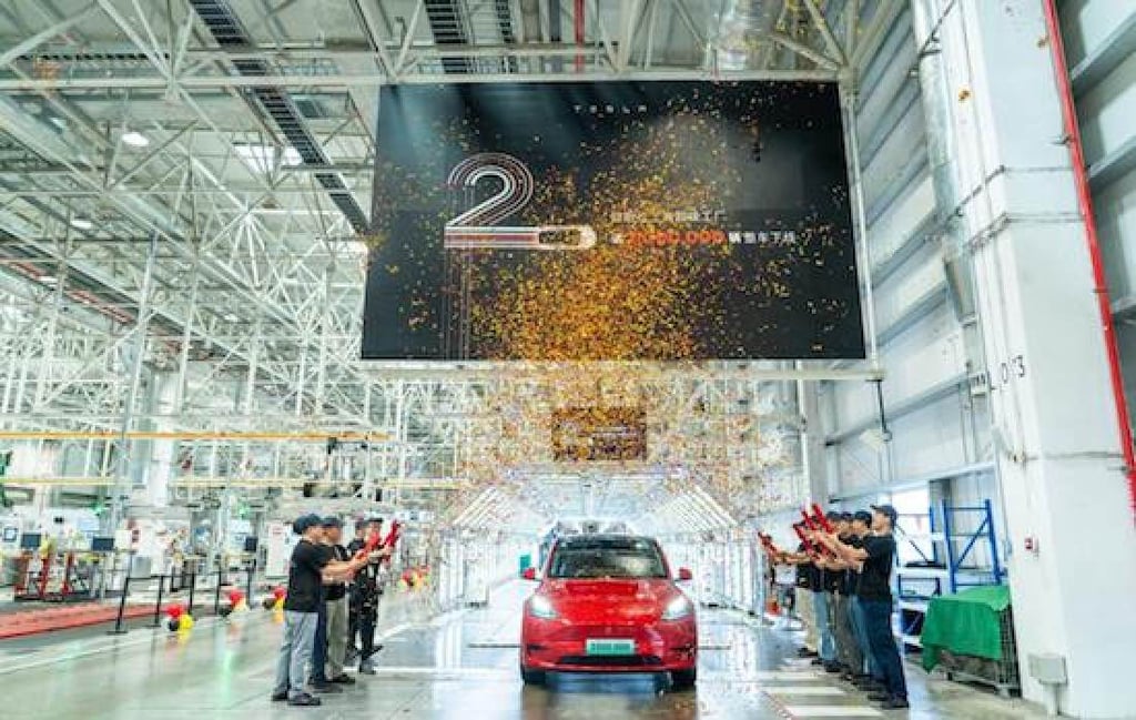 Tesla employees at the Shanghai Gigafactory 3 witness the 2 millionth vehicle roll off the production line on September 6, 2023. Photo: Handout