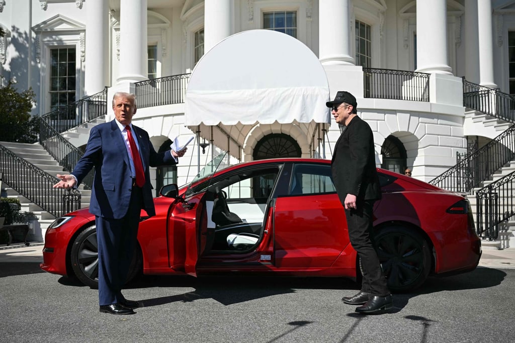 US President Donald Trump sought to boost plummeting Tesla share prices Tuesday by briefly turning the White House into a showroom. Photo: AFP
