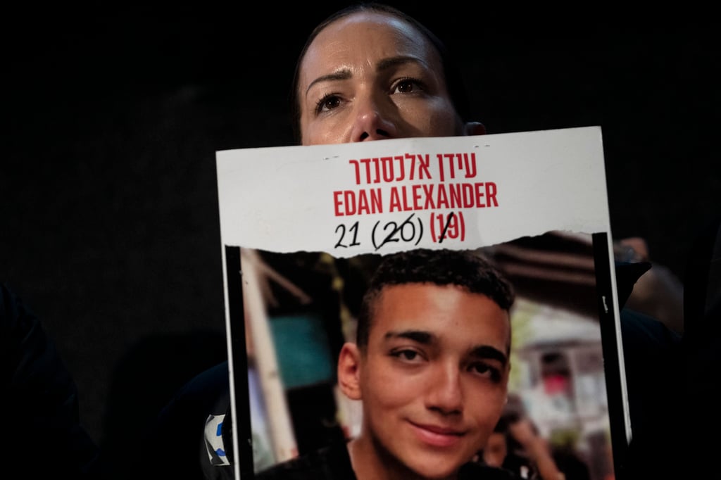 Yael Alexander holds a poster of her son Edan, a 21-year-old from New Jersey who served as a soldier with the Israeli military. Photo: AP
