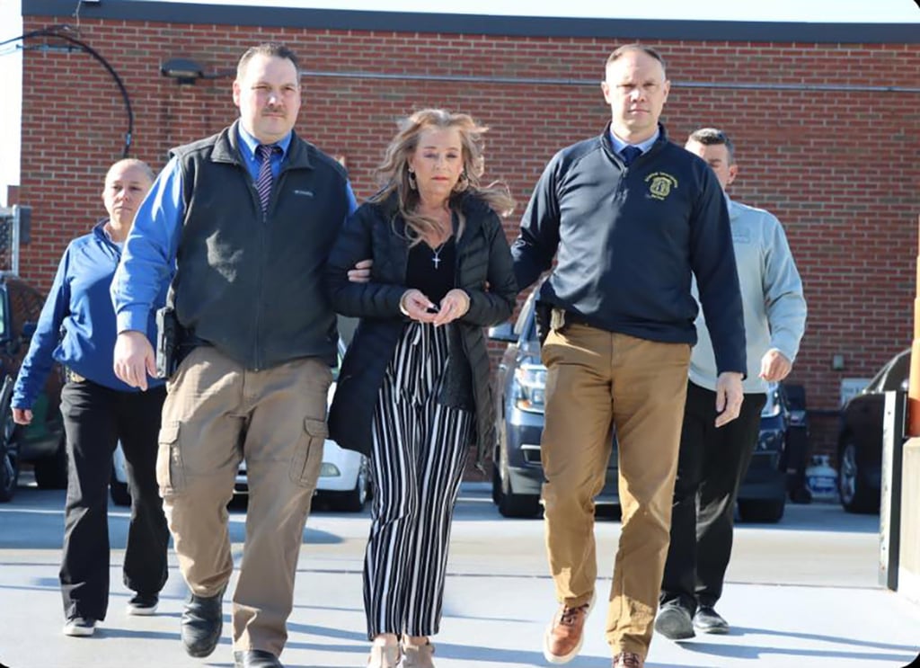 The man’s stepmother Kimberly Sullivan being taken into custody. Photo: Waterbury Police Department via TNS