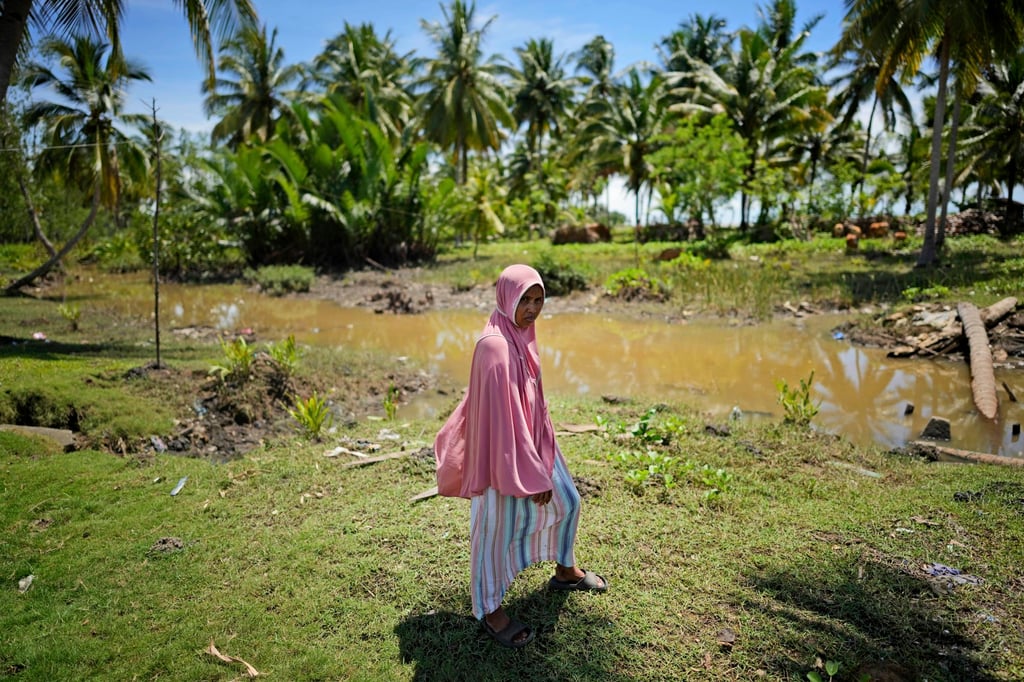 Munirpa, a crocodile-attack survivor, at the location where she was nearly killed by a four-metre-long crocodile in Topoyo, West Sulawesi, Indonesia. Photo: AP
