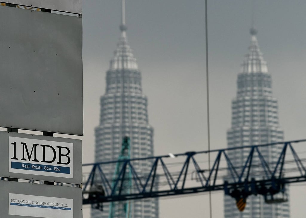 The 1MDB logo on a billboard at the funds flagship Tun Razak Exchange under-development site in Kuala Lumpur in 2015. Photo: AFP