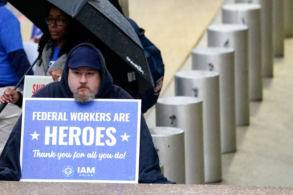 A labour union members holds a placard on the day of a rally in support of federal workers in Washington on March 24. Photo: Reuters