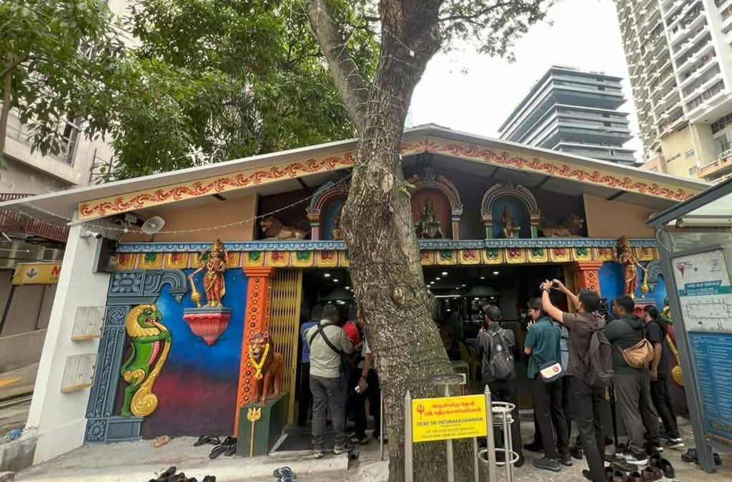 The Dewi Sri Pathrakaliamman temple is set in a small but desirable space between a block of flats and textile shops in central Kuala Lumpur. Photo: Facebook/Yuefo Amulets