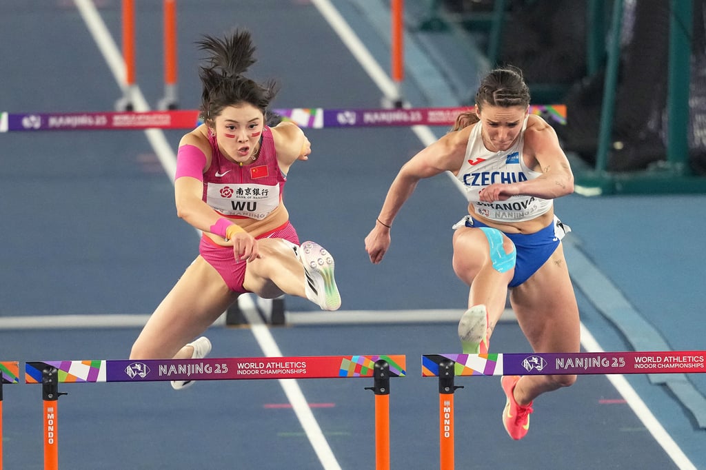 Wu Yanni (left) competes during the women’s 60m hurdles semi-finals. Photo: Xinhua
