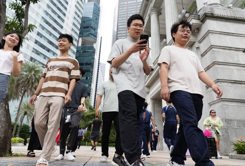 People walk in the Central Business District in Singapore. Photo: EPA-EFE