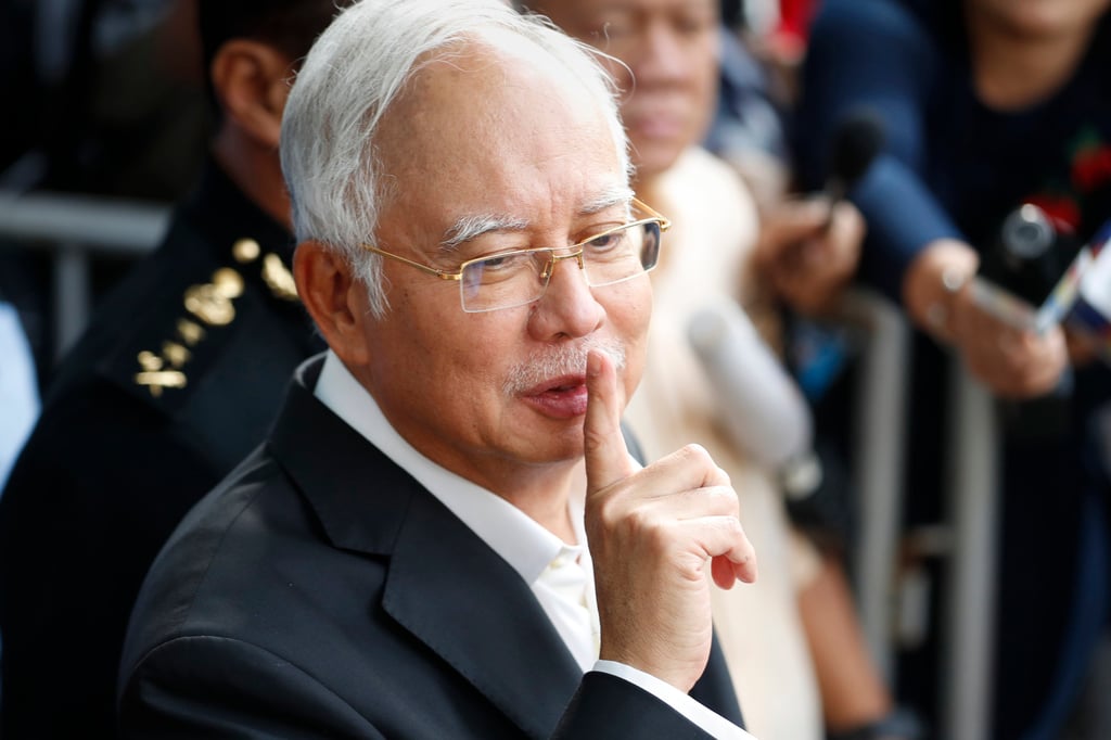 Former Malaysian Prime Minister Najib Razak gestures as he leaves the Malaysian Anti-Corruption Commission (MACC) office in Putrajaya in 2018. Photo: AP