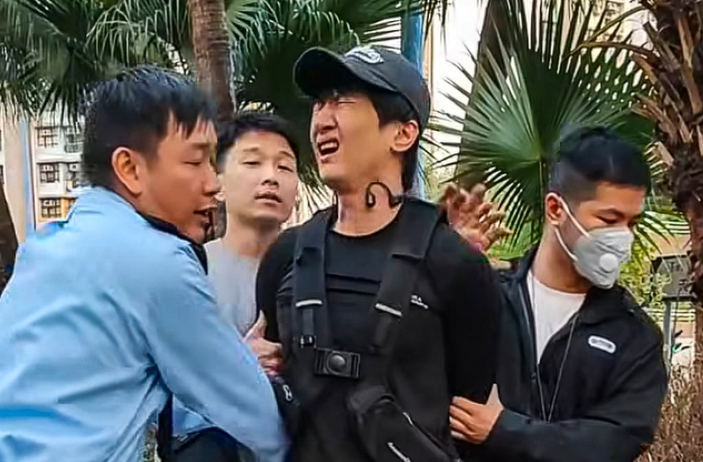 Police officers handcuffed ex-singer Roy Chow after illegally using an electric unicycle in Tin Shui Wai. Photo: Facebook/Ho Simon