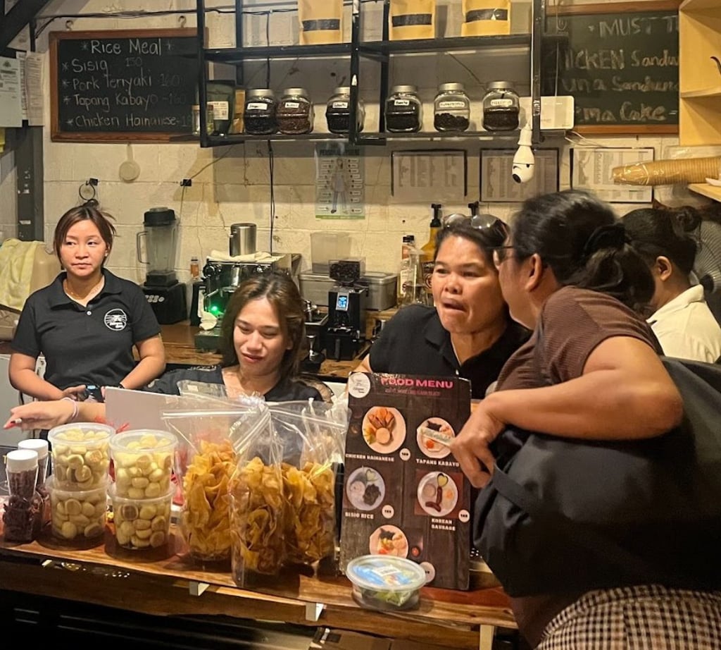 Sharon Angeles (left) with fellow baristas and relatives of drug war victims. Photo: Sam Beltran