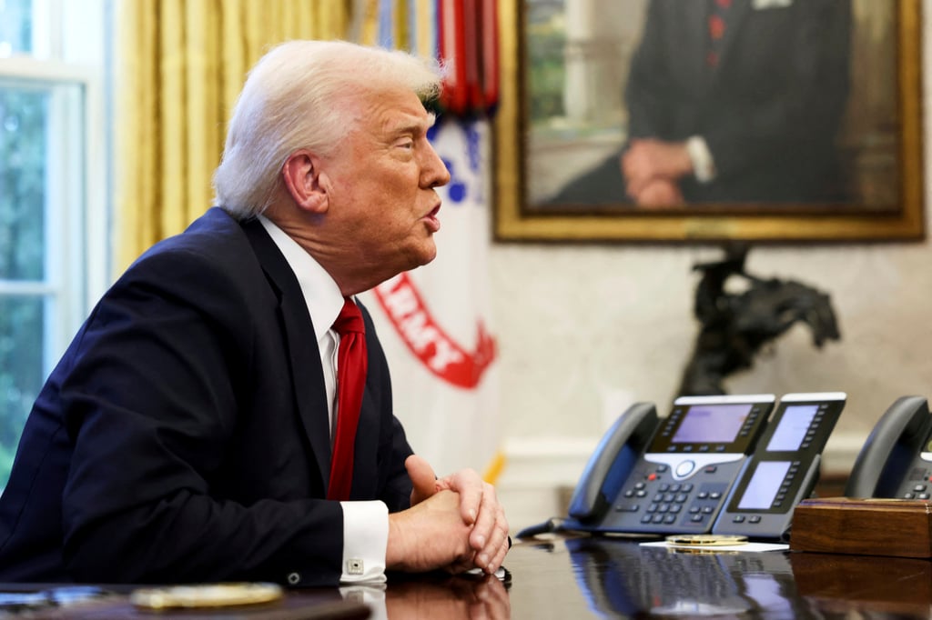 US President Donald Trump speaking to reporters in the Oval Office on Wednesday. Photo: Pool via AP