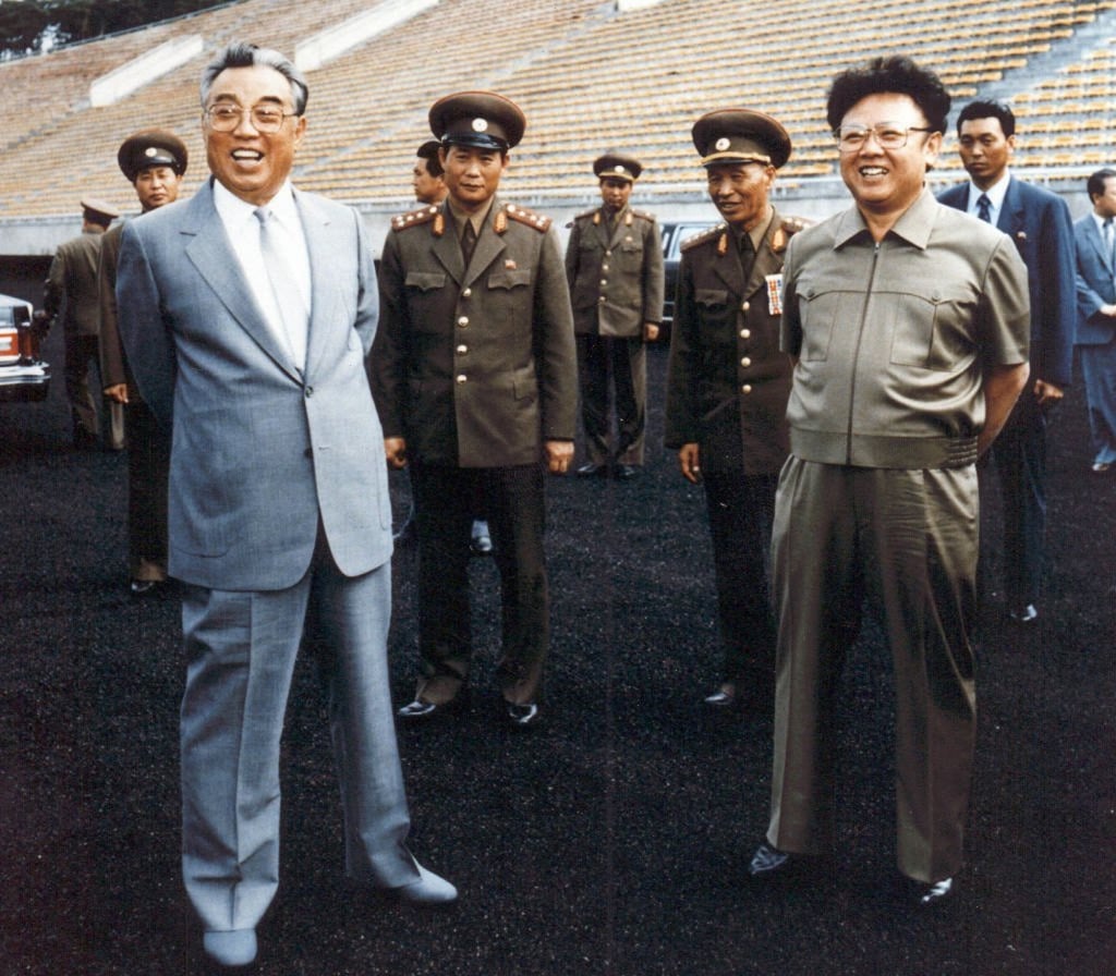 North Korea’s then-leader Kim Il-sung (L) and his son Kim Jong-il (R) inspecting a soccer ground in Pyongyang in 1992. Photo: AFP