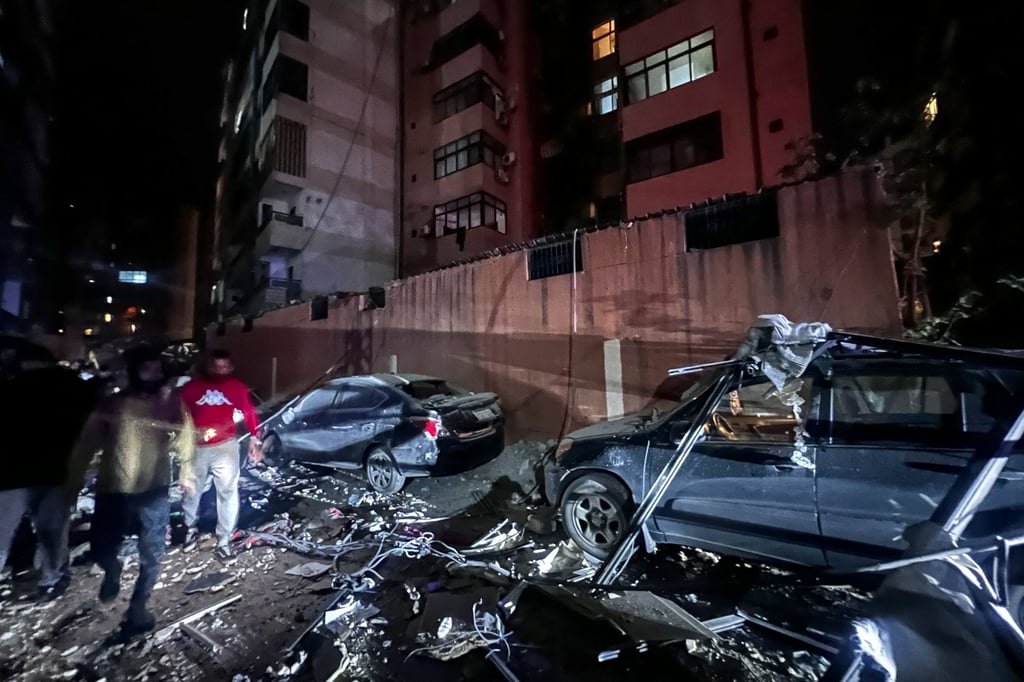 Debris covers a street at the scene. Photo: AFP