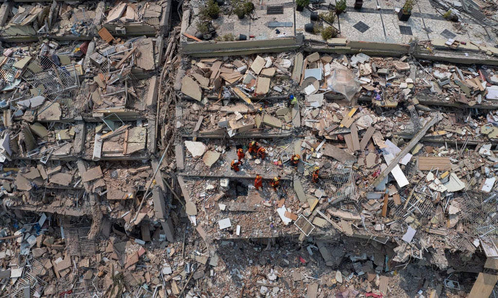 A rescue teams from mainland China and Hong Kong carry out a joint search and rescue operation at the Sky Villa residence in Mandalay, Myanmar, on Tuesday. Photo: Xinhua