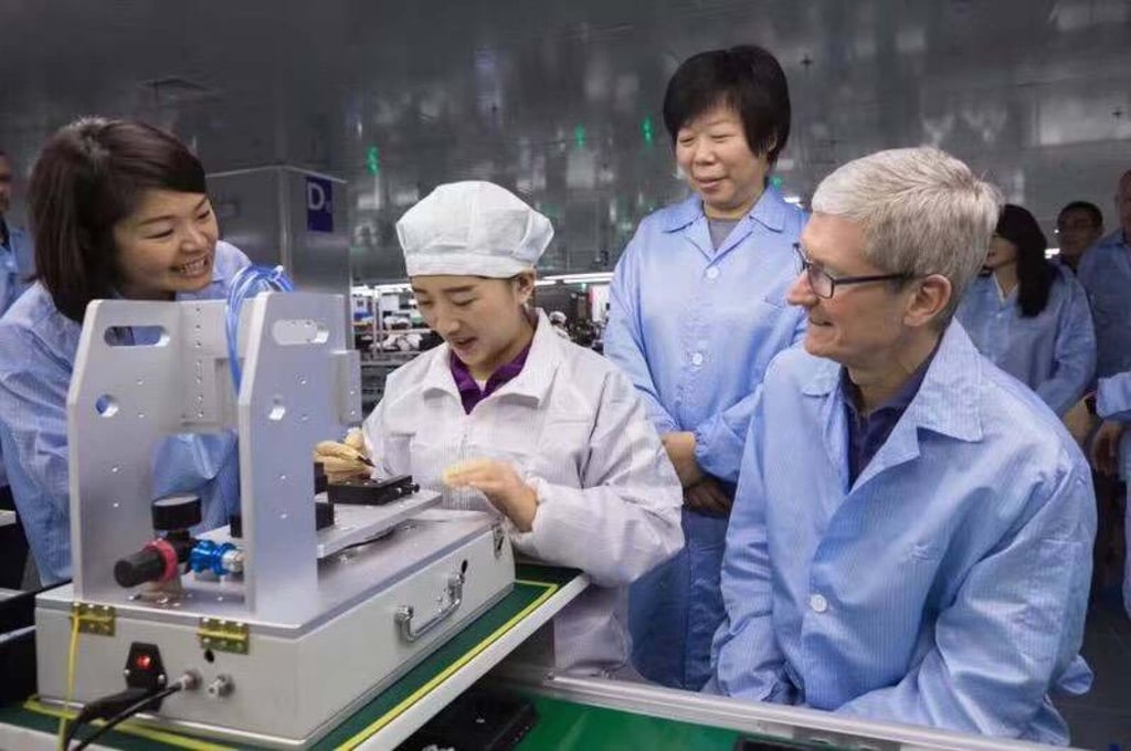 Apple CEO Tim Cook, right, visits a Luxshare plant in Kunshan, Jiangsu province, in 2017. Photo: Handout