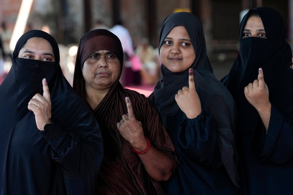 Indian Muslim women show their ink marked fingers after voting in Maharashtra state assembly elections in Mumbai in November 2024. Muslims, who are 14 per cent of India’s 1.4 billion population, are the largest minority group in the Hindu-majority nation. Photo: AP